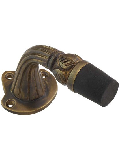 Solid Brass Reeded Floor-Mount Door Stop in Antique Brass.